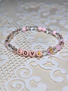 "LOVE" 6mm mixed pink, clear and white Beaded Bracelet.     ( size 7.5" )