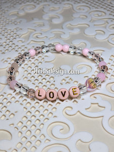 "LOVE" 6mm mixed pink, clear and white Beaded Bracelet.     ( size 7.5" )