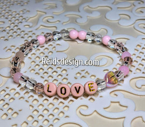 "LOVE" 6mm mixed pink, clear and white Beaded Bracelet.     ( size 7.5" )