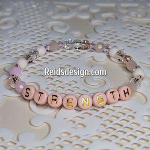 "STRENGTH" 6mm mixed pink, clear and white Beaded Bracelet.     ( size 7.5" )