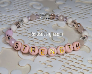 "STRENGTH" 6mm mixed pink, clear and white Beaded Bracelet.     ( size 7.5" )