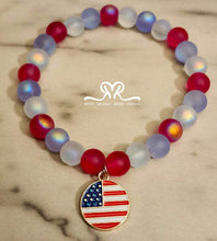 Load image into Gallery viewer, 🇺🇸 Celebrate America's 250th Independence Day! 🇺🇸

NEW! Celebrate in style with our one-of-a-kind, handcrafted 7.5-inch red, white, and blue stackable bracelet, featuring glass beads beautifully accented with an American flag charm.
