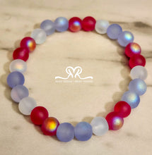 Load image into Gallery viewer, 🇺🇸 Celebrate America's 250th Independence Day! 🇺🇸

NEW! Celebrate in style with our one-of-a-kind, handcrafted 7.5-inch red, white, and blue stackable bracelet, featuring glass beads beautifully accented with an American flag charm.