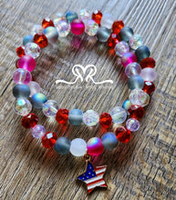 Load image into Gallery viewer, 🇺🇸 Celebrate America's 250th Independence Day! 🇺🇸

NEW! Celebrate in style with our one-of-a-kind, handcrafted 7.5-inch red, white, and blue stackable bracelet, featuring glass beads beautifully accented with an American flag charm.